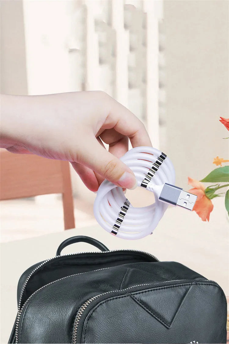 Black magnetic data cable showing Micro USB, USB Type-C and 3.5mm connector interfaces with ends snapped together