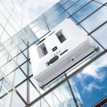 White intelligent small window cleaner robot on smooth indoor glass surface with plastic body