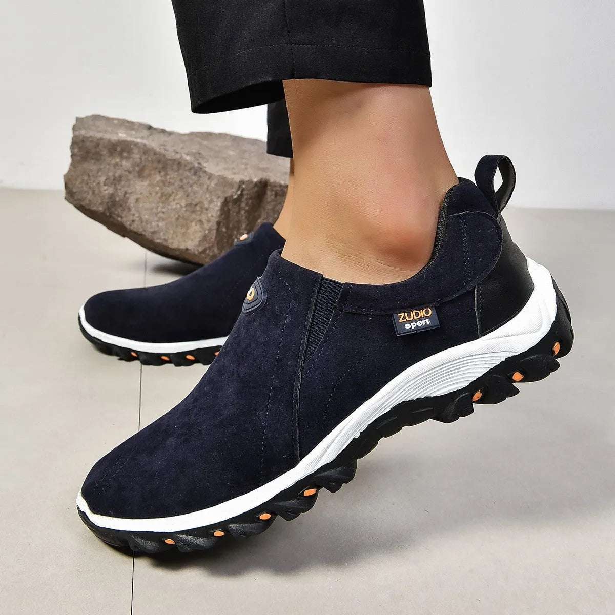 Men's grey round head overshoe cover with rubber sole, shown from the side.