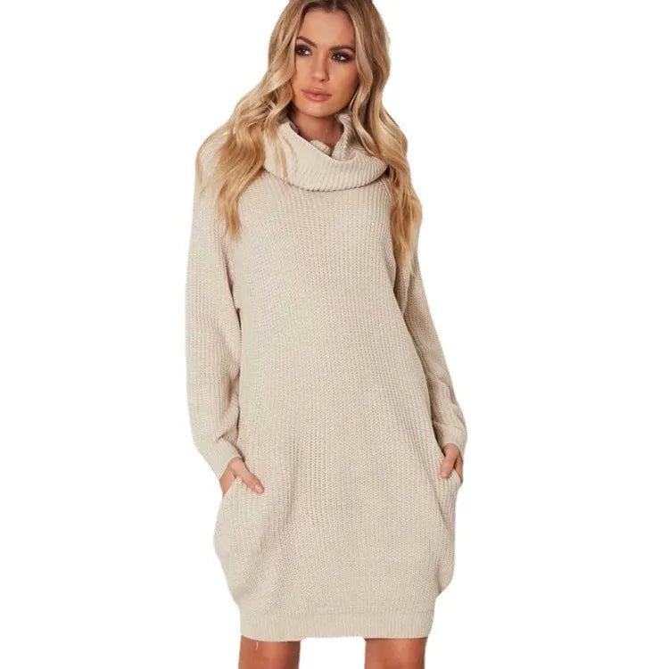 Light apricot coloured mid-length pullover sweater with a lapel collar and side pockets on a model.