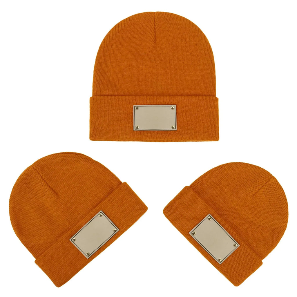 Knitted warm pullover hat in acrylic fibre with dome top and no brim, available in six colours and sizes S, M, L.