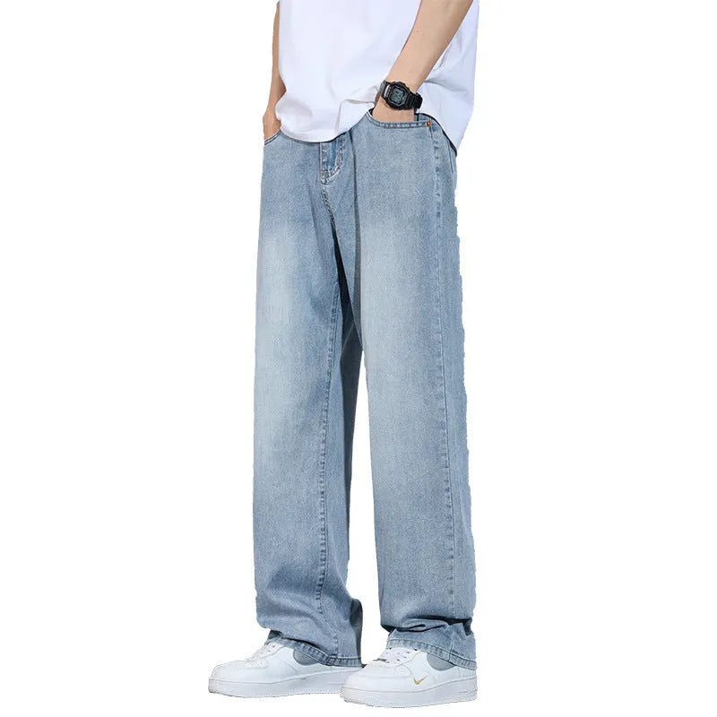 Men's straight leg trousers in ice silk denim with wide leg silhouette showing zip fly detail