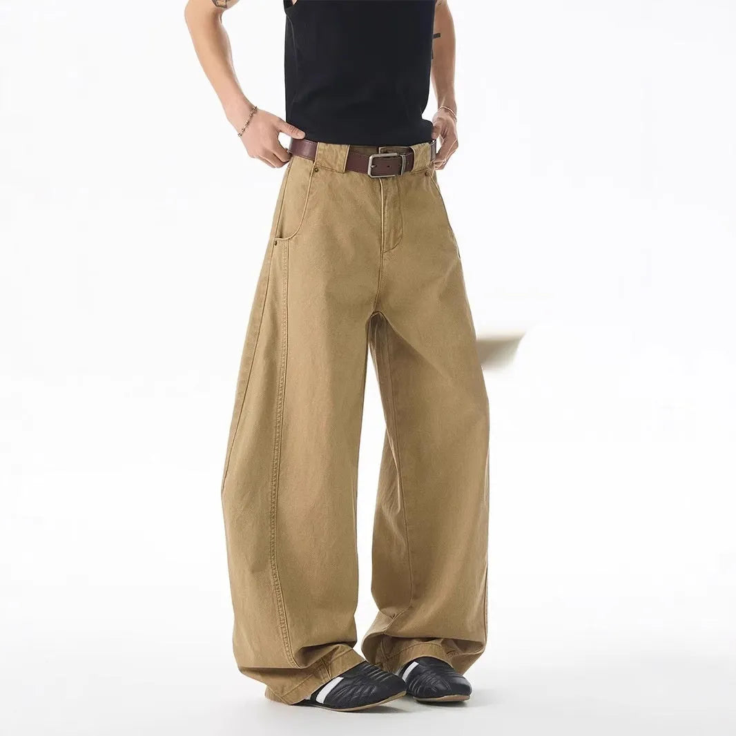Men's brown straight-leg casual denim jeans with a loose fit and cardigan-style button fly.