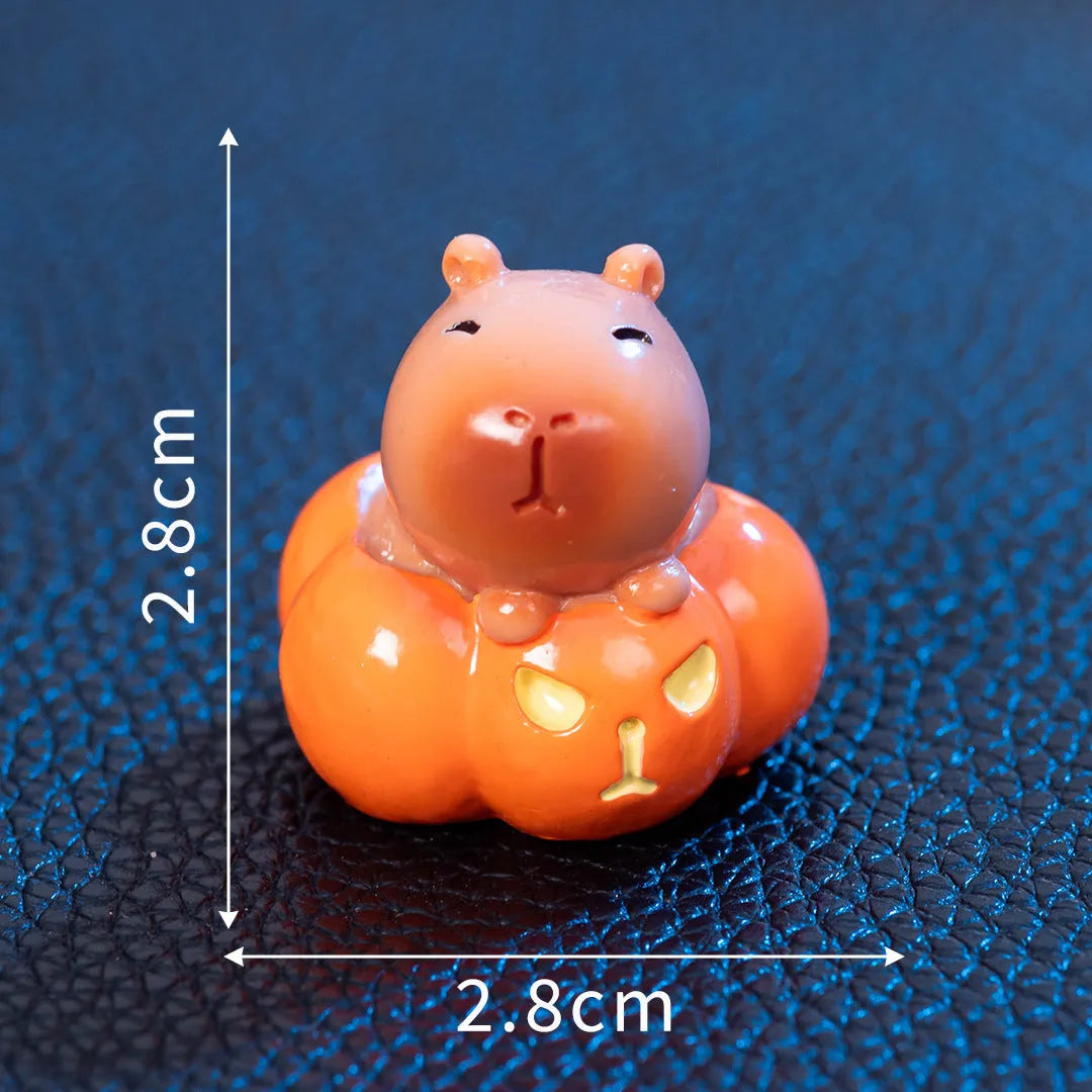 Eight different Halloween-themed capybara resin figurines displayed together