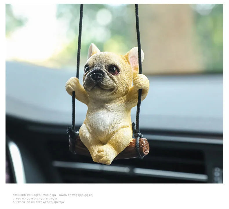 Cartoon-style resin bulldog car pendant hanging from a rearview mirror.