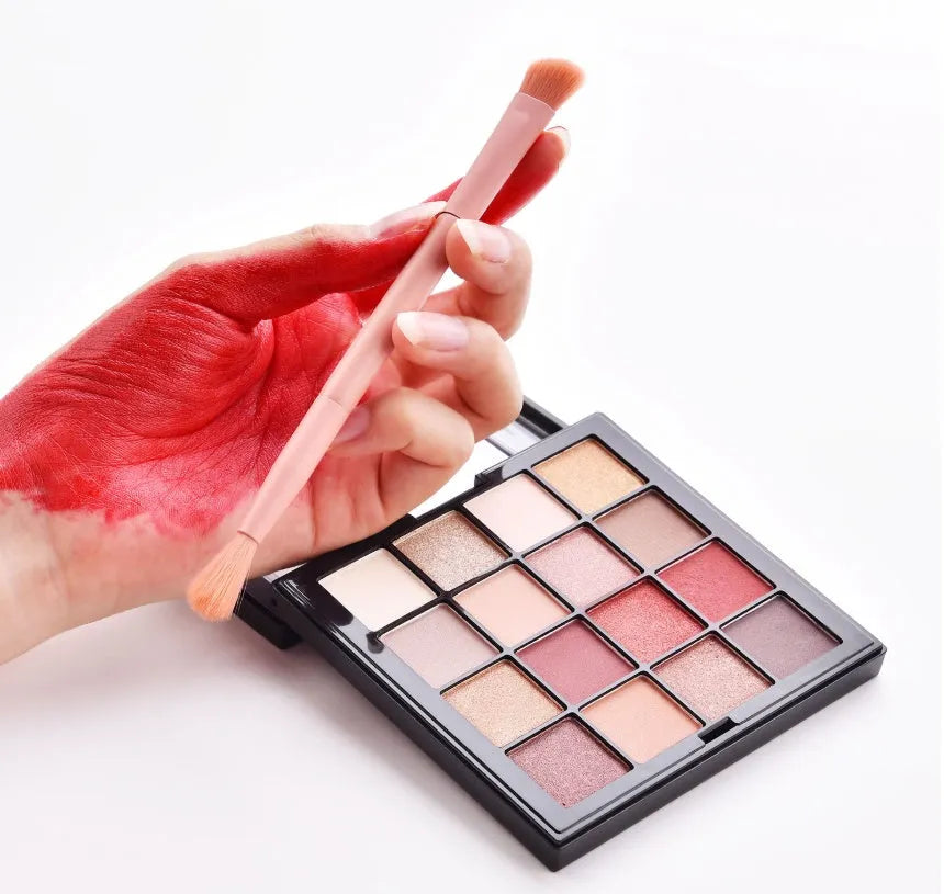 10 professional makeup brushes with wooden handles in a pink case including foundation, powder, and dual-ended brushes