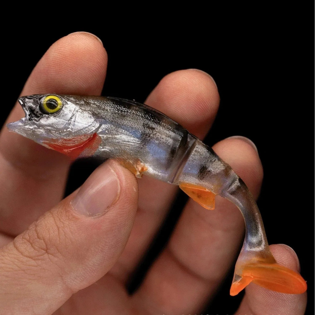Soft plastic fishing lure with scissor-tail catfish design and fish pattern colour