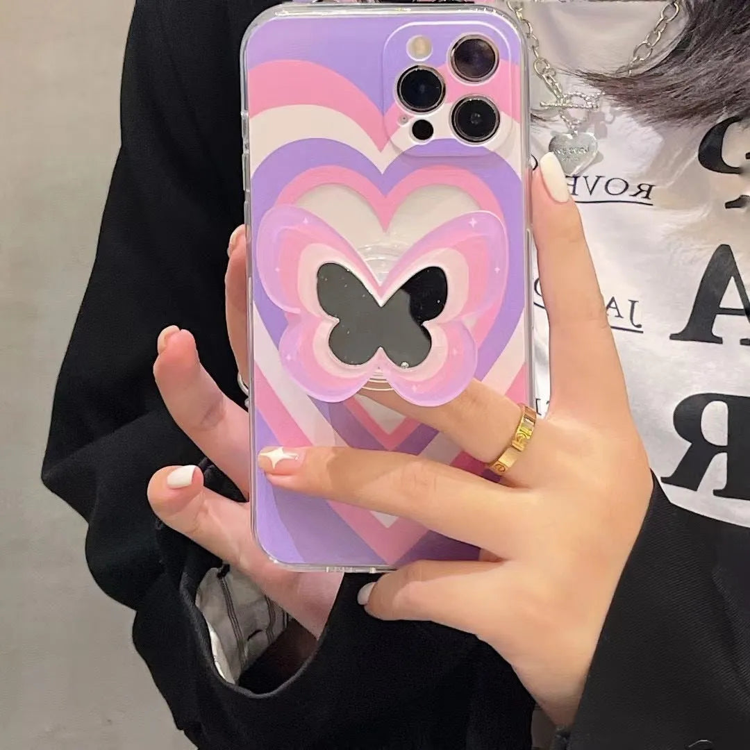 Color butterfly stand silicone phone case for iPhone in blue with TPU back cover and folded-out stand on a table