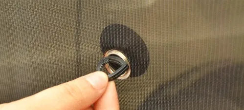 Black net yarn car sunshade sunscreen folded on car dashboard for glare reduction