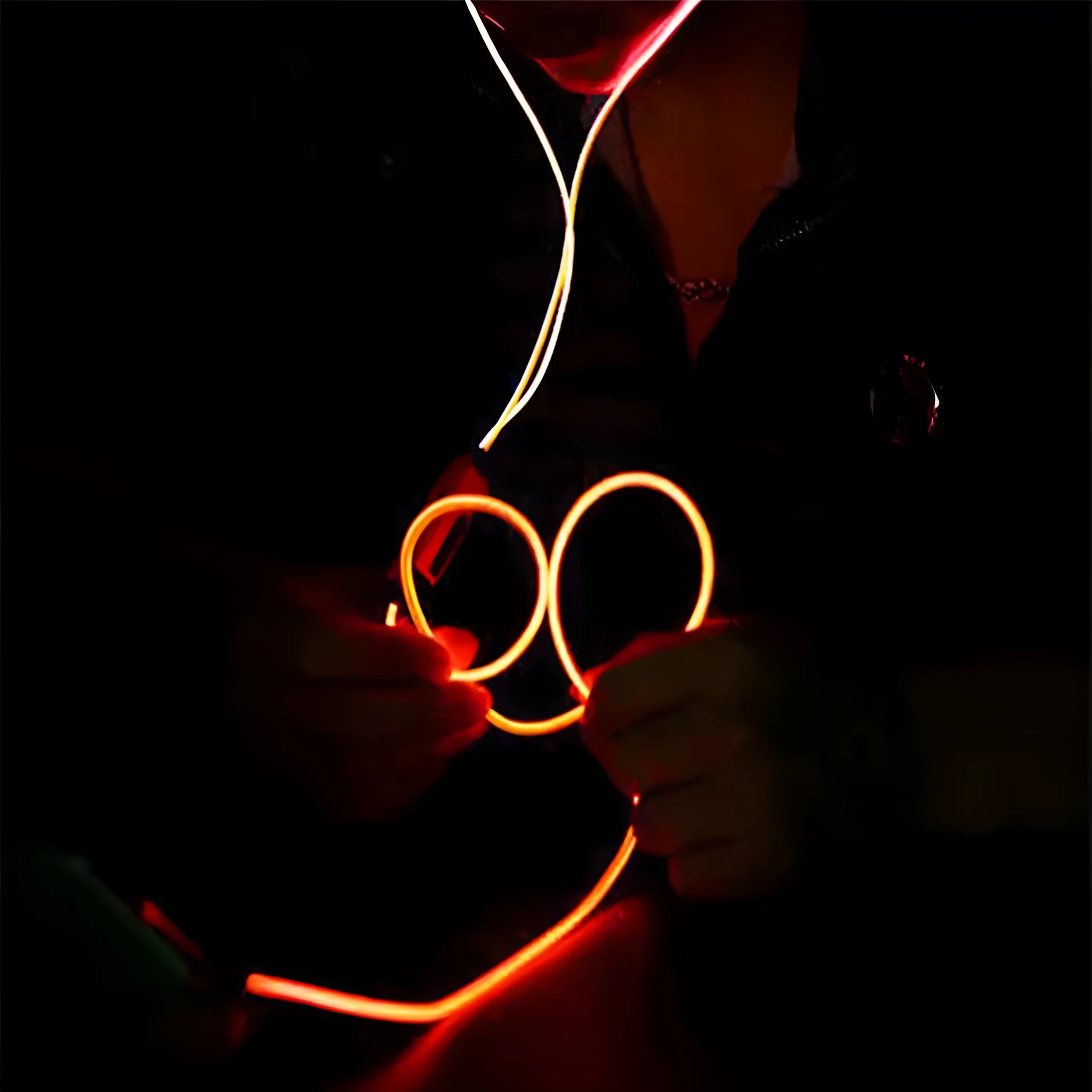 Blue LED light-up earphones with 3.5mm jack, compatible with iPhones, showing illuminated earpieces.