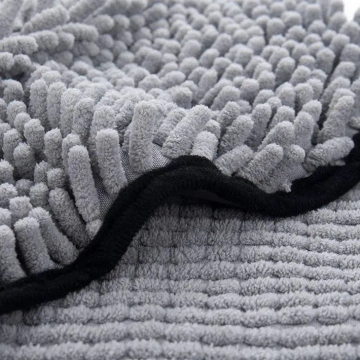 Blue quick-dry pet bath towel shown draped, sized 62 cm by 23 cm for drying dogs and cats.