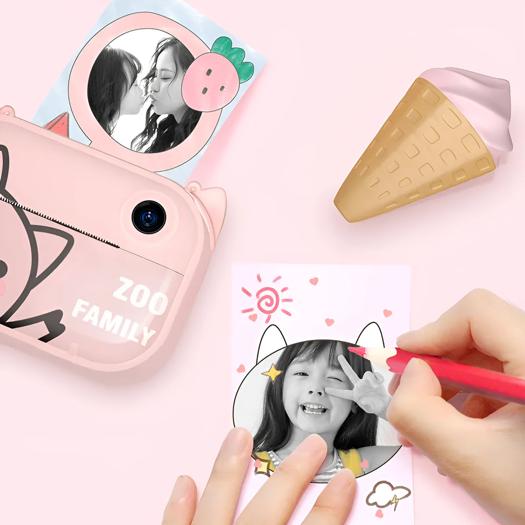 Blue, green, and pink coloured HD digital camera with 2.4-inch screen and accessories including printing paper.