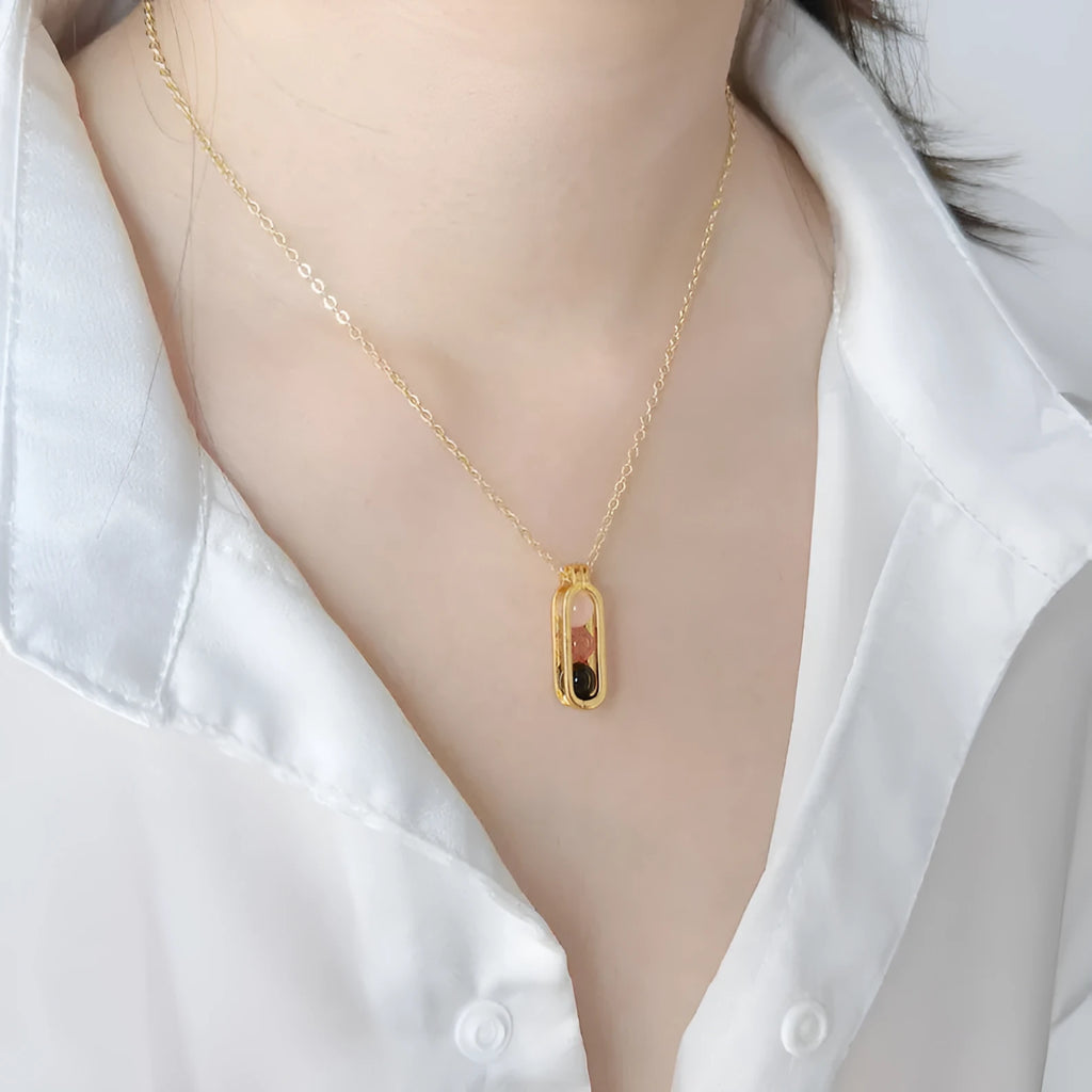 Minority simple pearl necklace in titanium steel with inlaid pearl, shown in gold or silver steel colour.