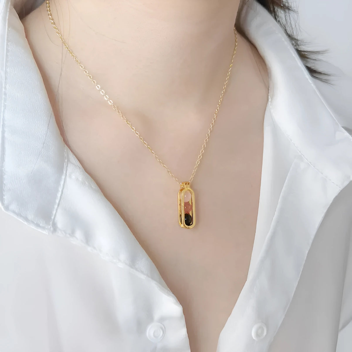 Minority simple pearl necklace in titanium steel with inlaid pearl, shown in gold or silver steel colour.