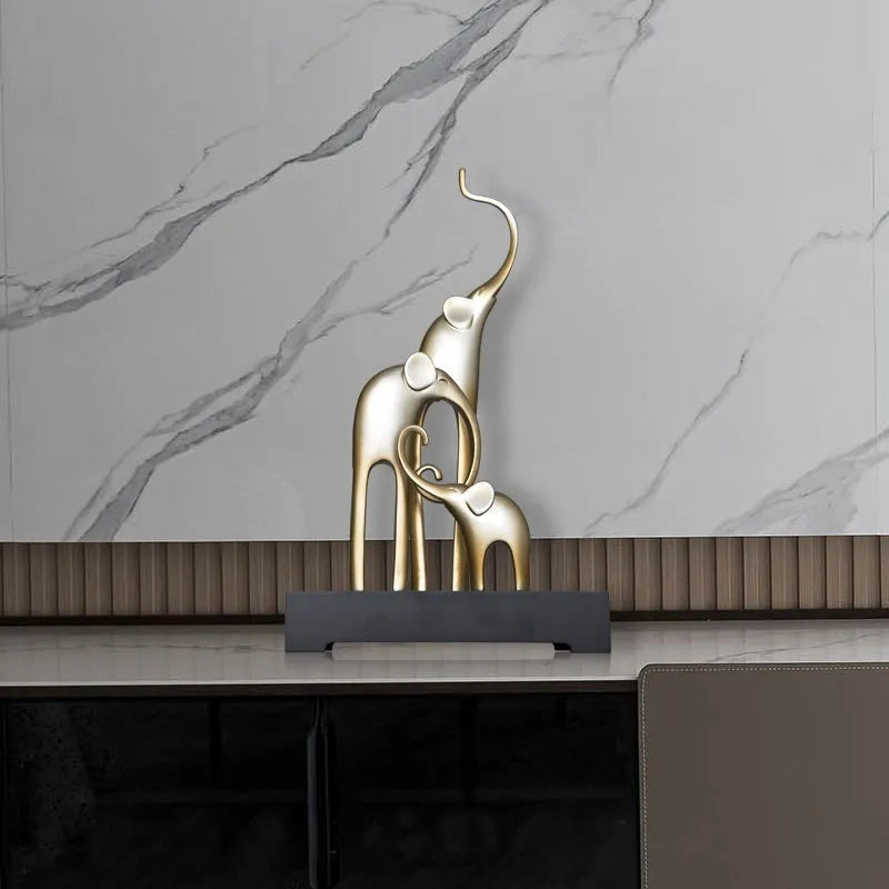 Resin elephant decorative ornament in metallic gold finish measuring 6.5cm tall