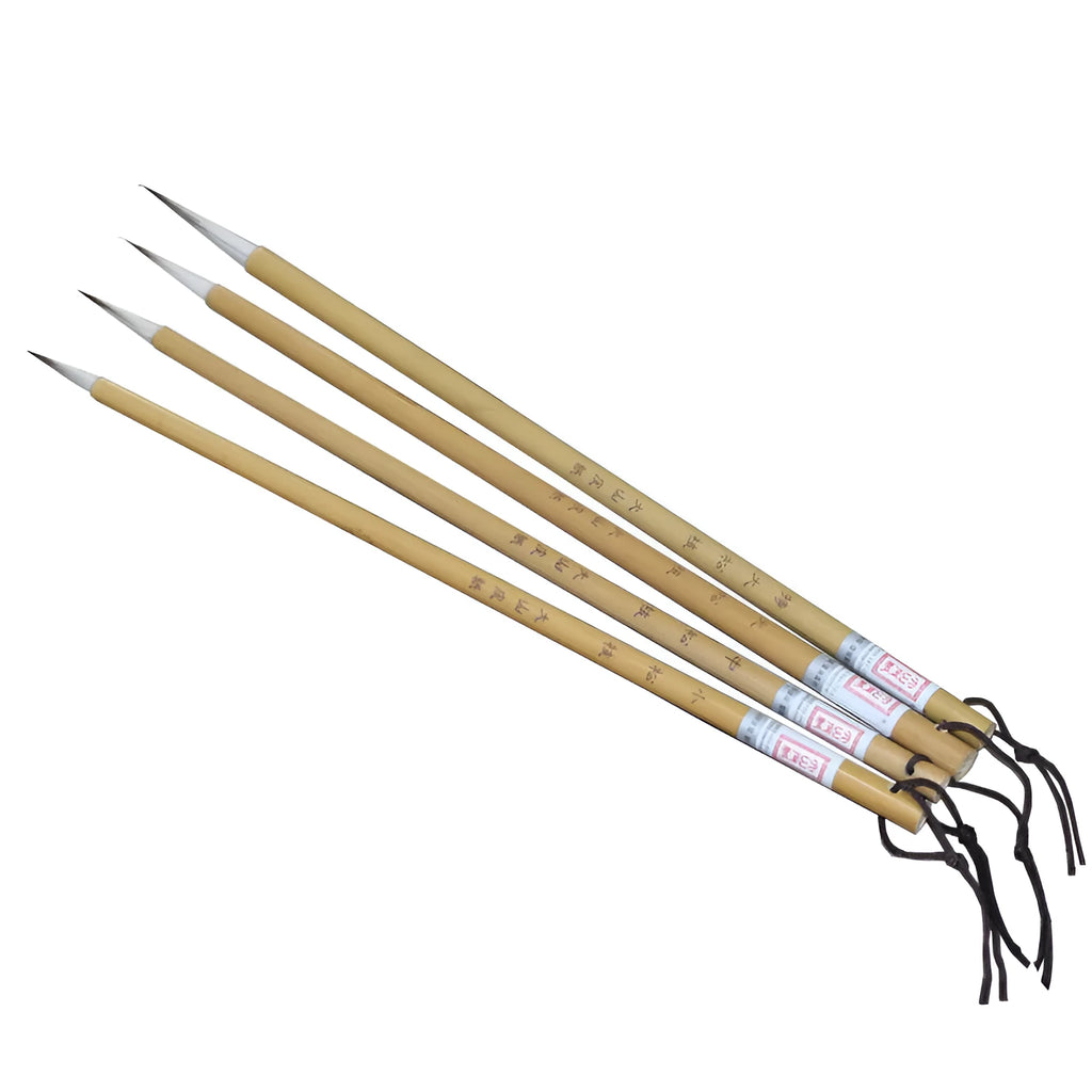 Set of four gold-handled writing brushes with mixed hair bristles for calligraphy.