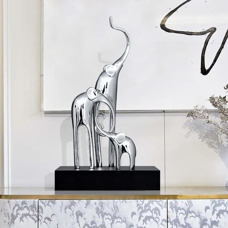 Resin elephant decorative ornament in metallic gold finish measuring 6.5cm tall