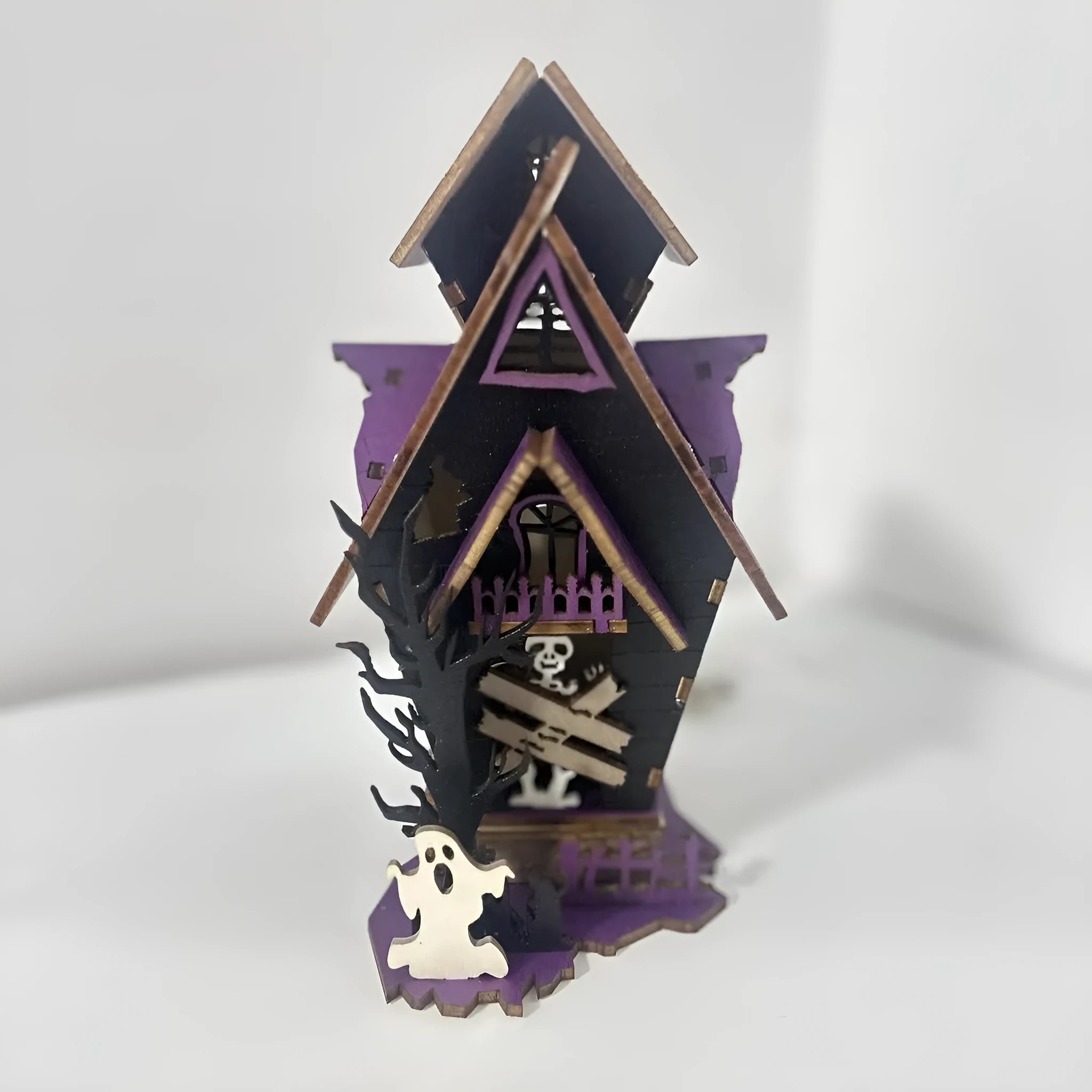 Wooden glowing haunted house Halloween table decoration with candlestick holder, 14cm wide.