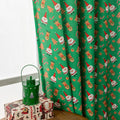 Red American-style cloth curtain with printed cartoon angels and snowmen, one metre wide.