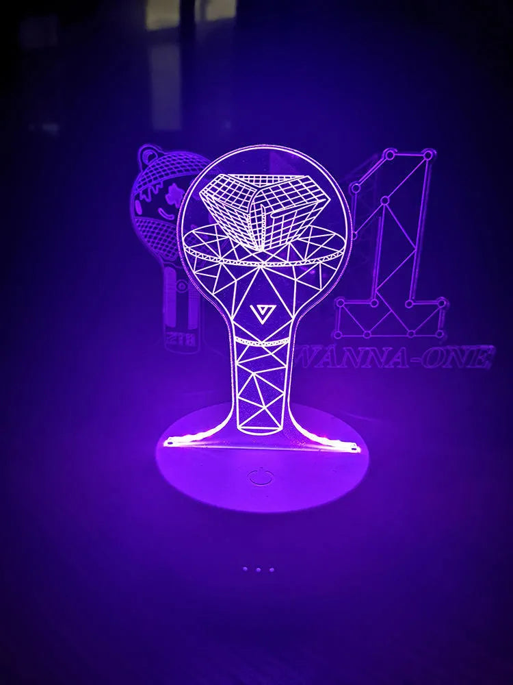 Clear acrylic display stand supporting 101 Tower Gem BTS lamp with universal voltage compatibility