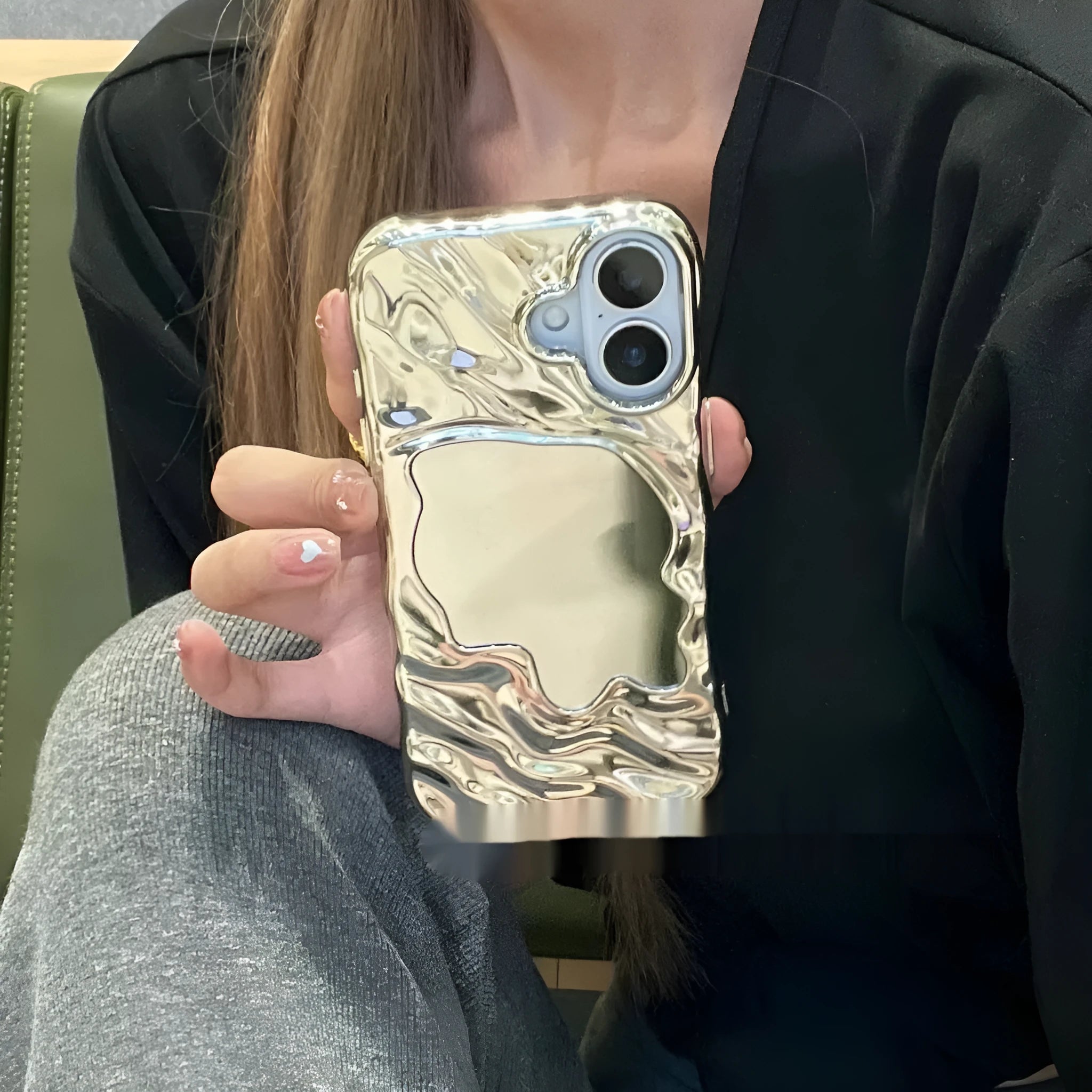 Simple solid colour iPhone case with water ripple texture and a small mirror, shown in beige.