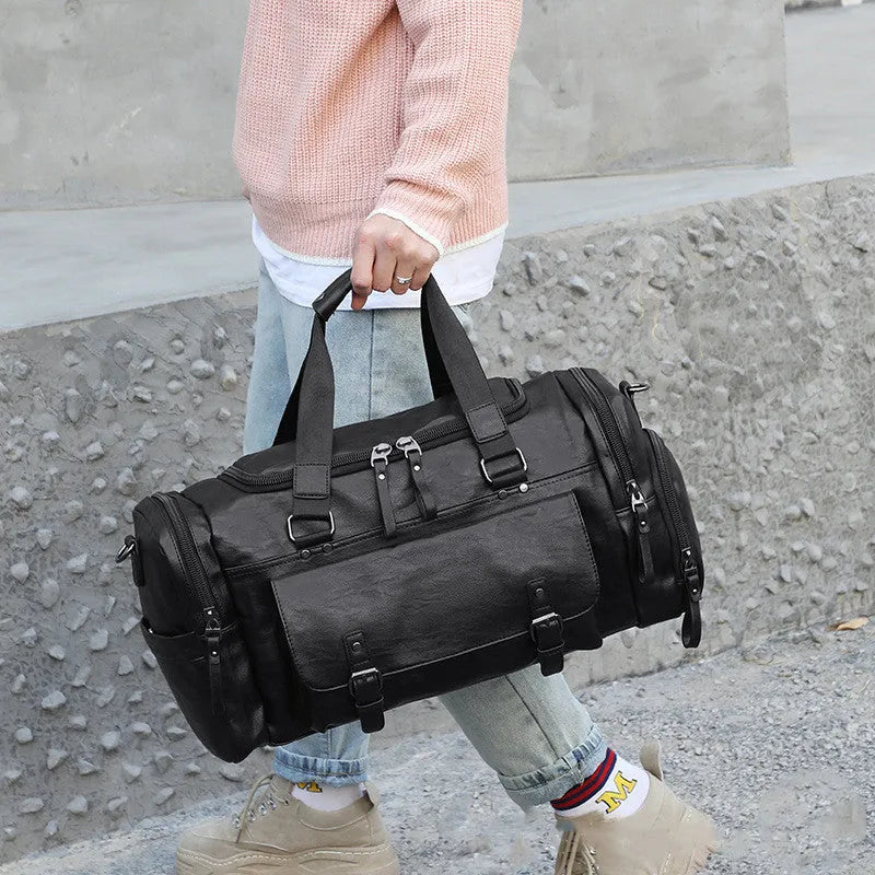 Black large capacity travel holdall with a separate shoe compartment.