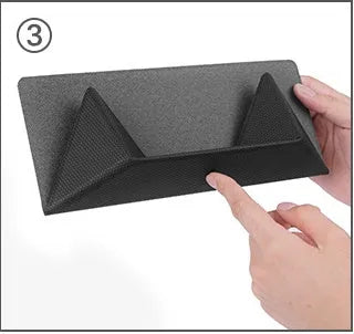 Blue foldable laptop cooling bracket with anti-slip surface shown open next to a closed laptop