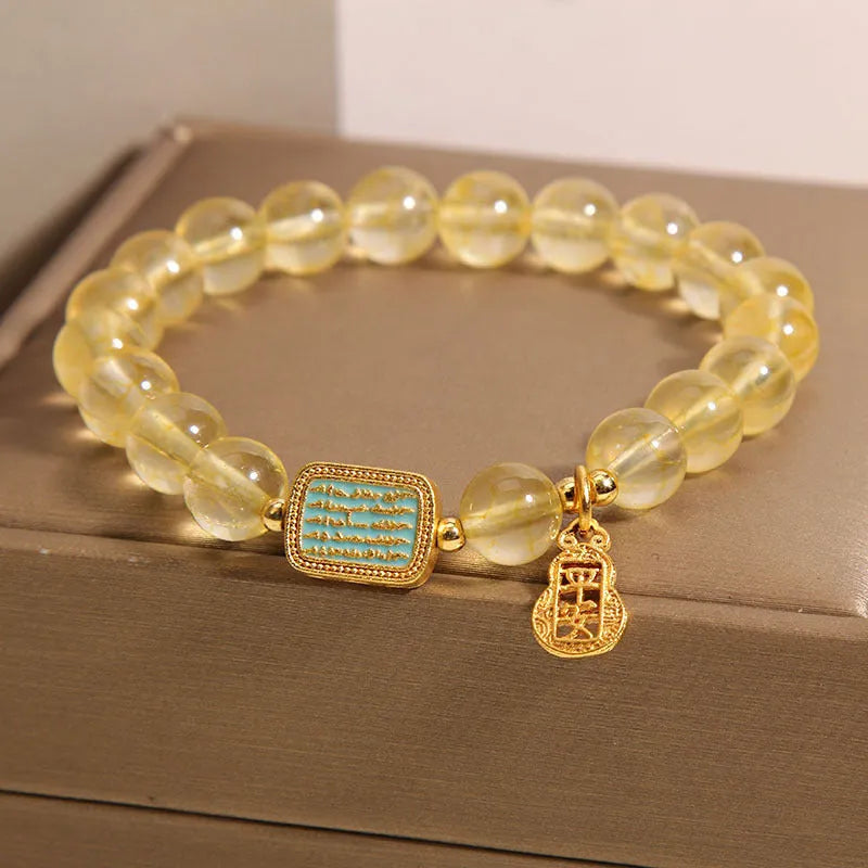 Women's yellow citrine crystal bracelet with rhinestone detailing and adjustable closure