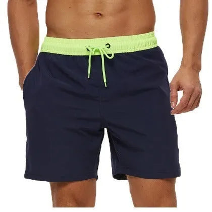 Men's blue athletic shorts with a drawstring waist, zipper pockets, and visible stitching detail.