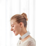 White electric acupressure handheld massager for back neck and shoulder pain relief.