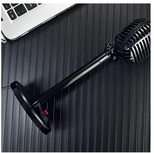 Black USB computer microphone on an adjustable stand with a foam windscreen and long cable.