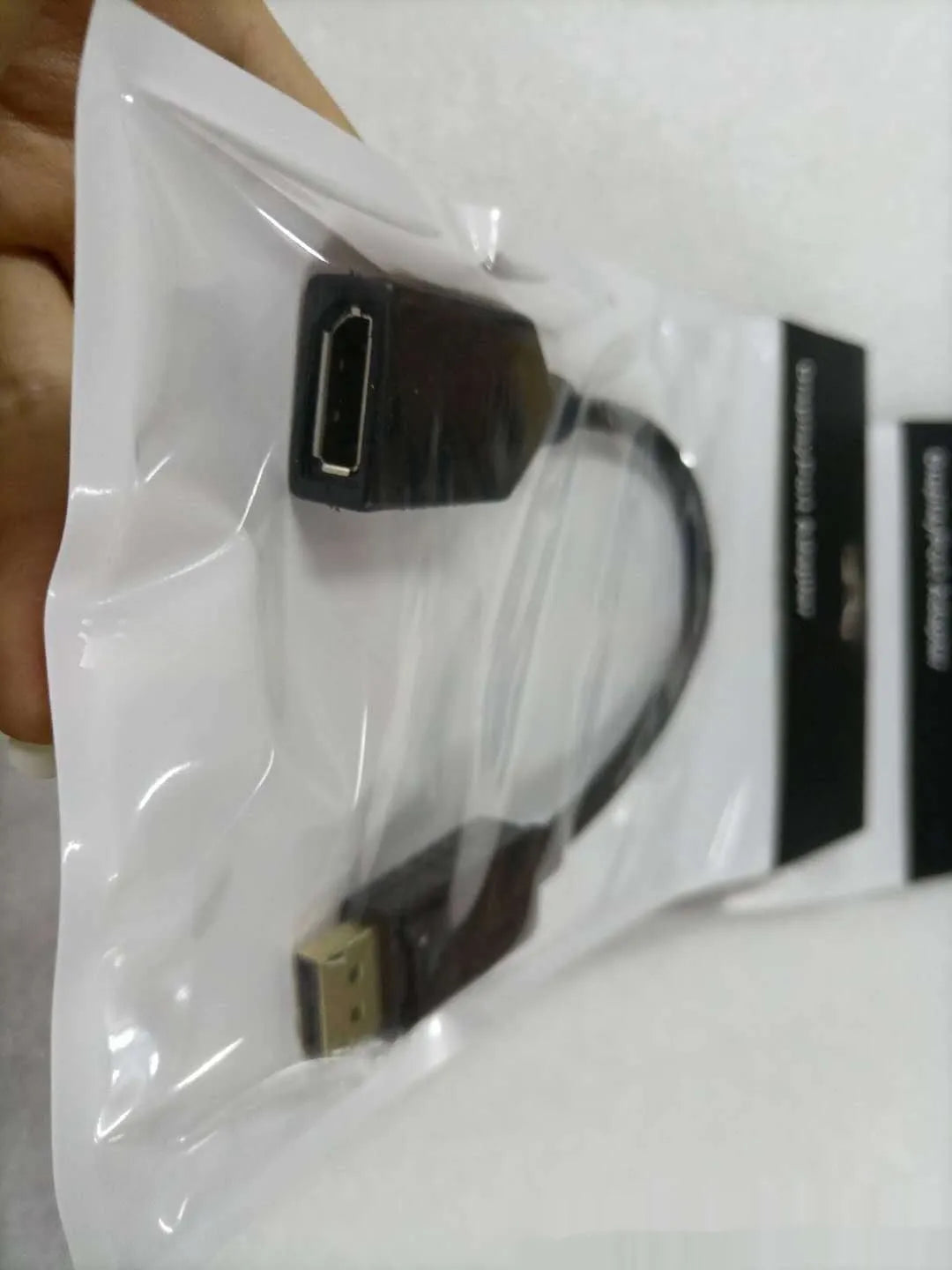 Black Display Port DP male to female extension cable approximately 10cm long with rotating adapter