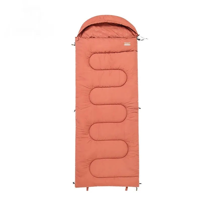Ochre and olive green portable cotton camping sleeping bag quilt laid out flat.