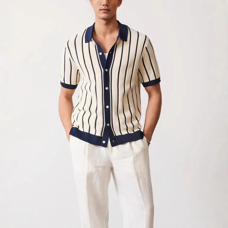 Men's white asymmetrical short sleeve knitted top with a lapel collar, shown on a model.