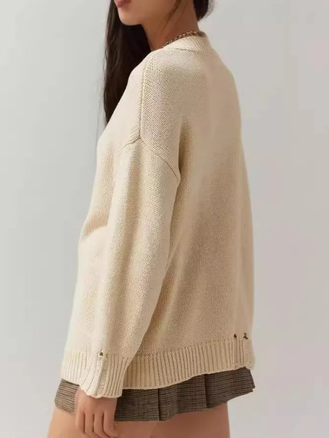 Women's loose-fitting acrylic jacquard pullover sweater in milky white with round neck and long sleeves