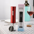 Black electric wine bottle opener with automatic corkscrew and foil cutter on a kitchen counter