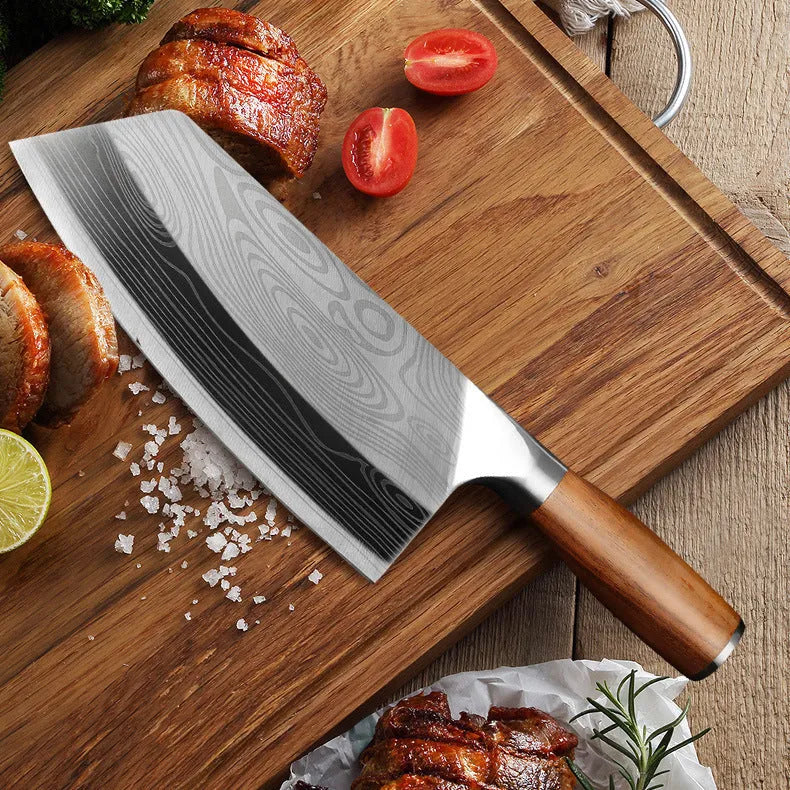 A stainless steel kitchen knife with a 320mm blade on a cutting board.