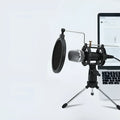 Black mini condenser microphone mounted on aluminium stand with 3.5mm and USB cables for live broadcasting
