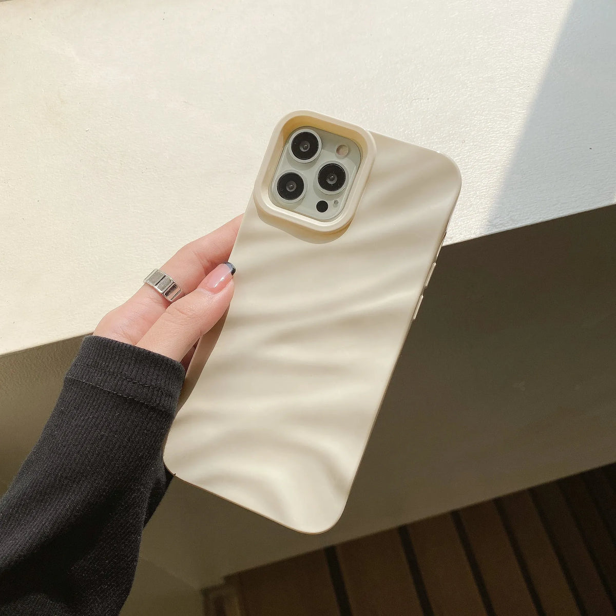 Soft solid colour wave pleated TPU protective case for Apple iPhone 17 series in burgundy on a white background.