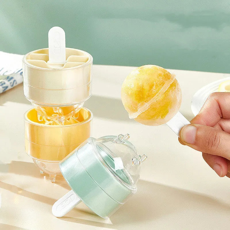Set of four creative silicone lollipop ice molds in assorted pastel colours on a light background