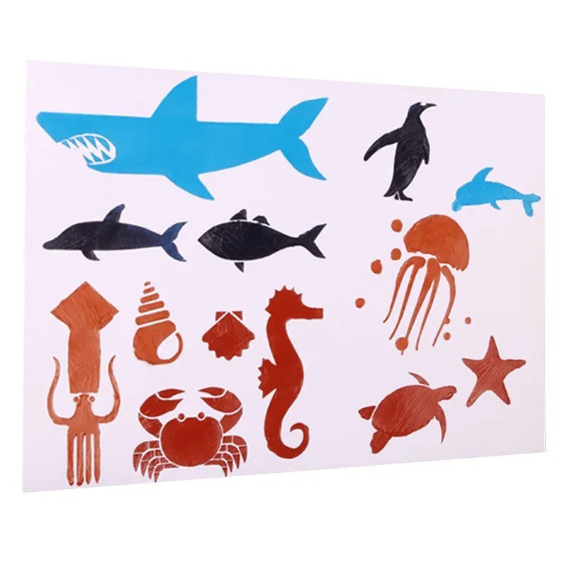 Set of white plastic drawing stencils with various cut-out design patterns