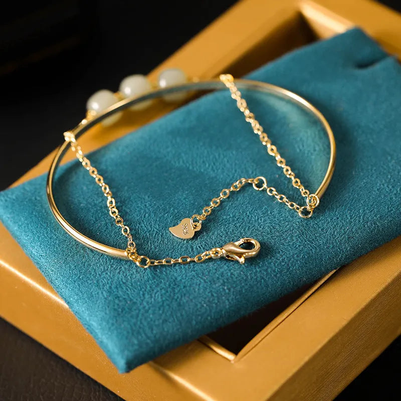 Women's Hetian jade lucky beads bracelet with gold inlay, shown in single, double, and three beads versions.