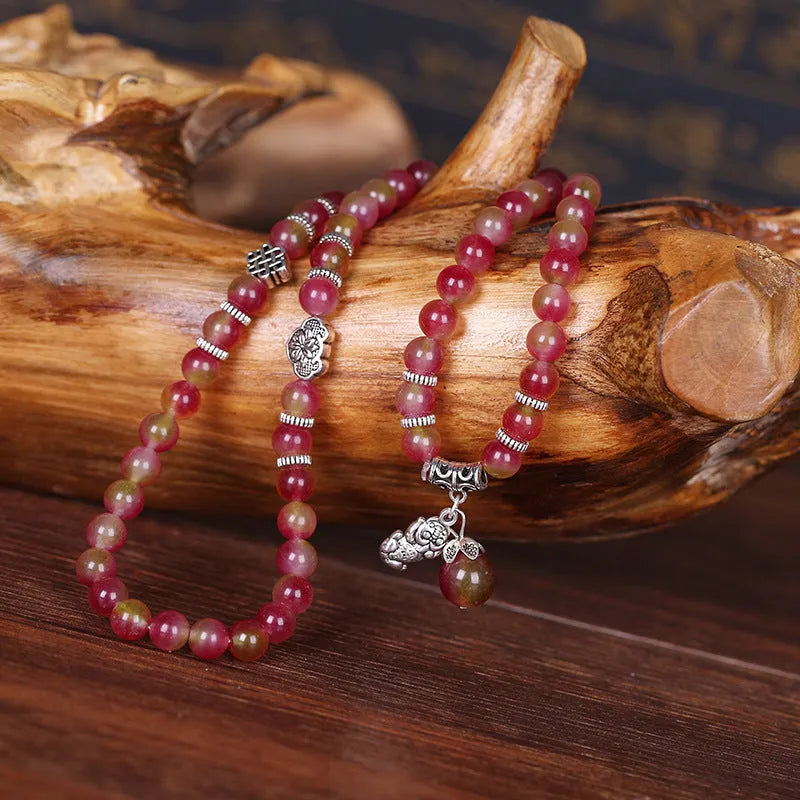 Watermelon crystal bracelet with Chinese knot design showing geometric natural stone beads