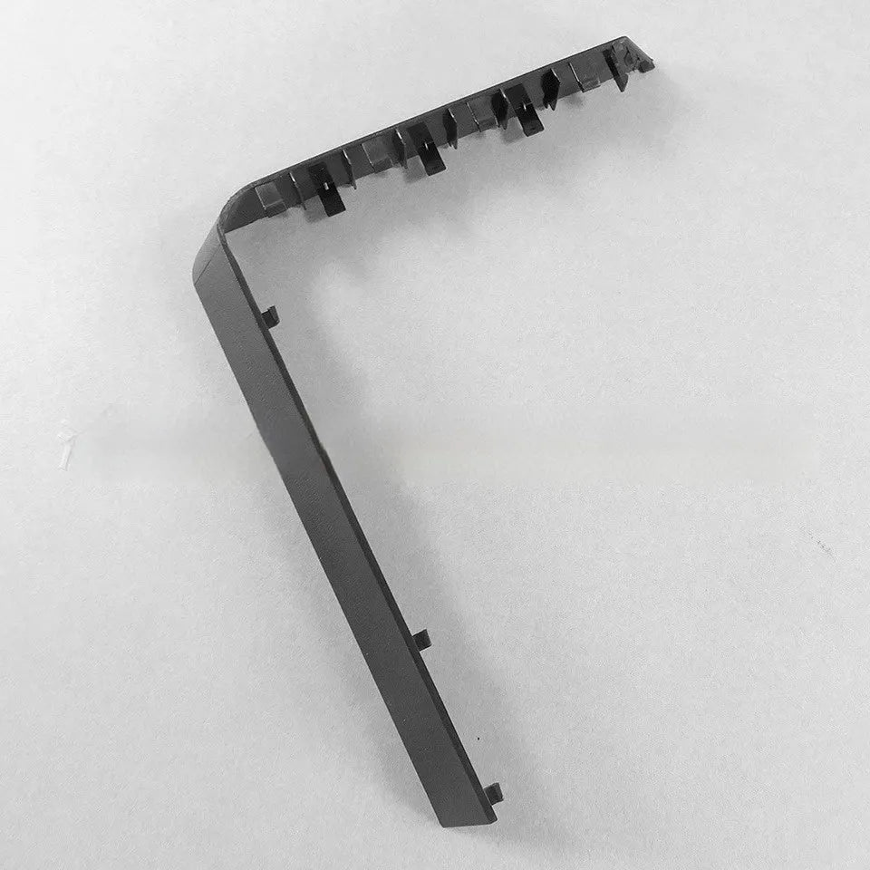 A black plastic hard drive bay cover for a computer case.