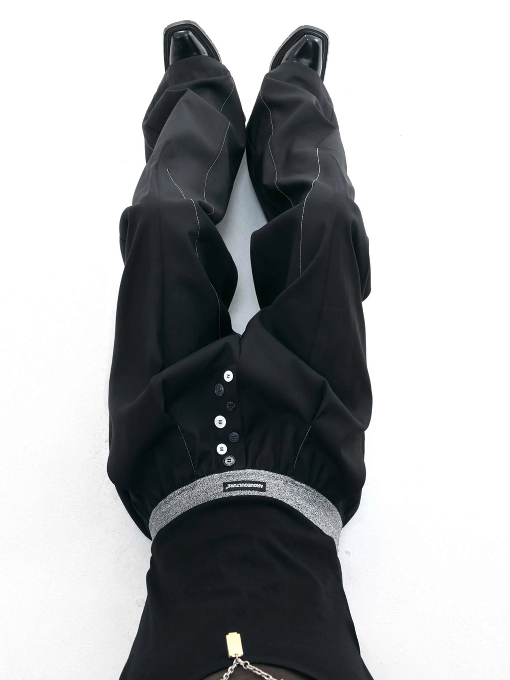 Straight-leg high-waisted casual trousers with button open line detail in black and grey colours