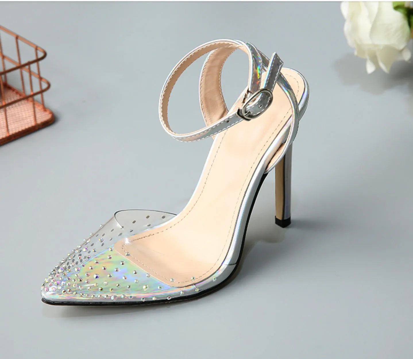 Women's pointed toe diamond sandals with stiletto heel on a white background.