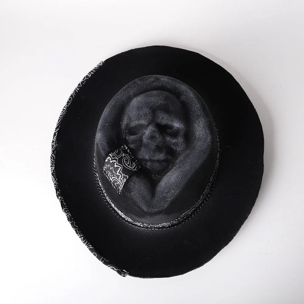 Handmade wool skull hat with a conical crown, shown in its specified colour, laid flat.