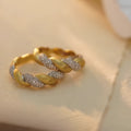 S925 sterling silver twist ring for women, yellow gold finish, geometric pointed band on white background
