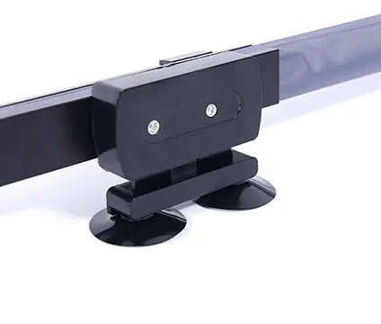 Car sun visor of aluminised film measuring 46cm sliding into position on a car windscreen