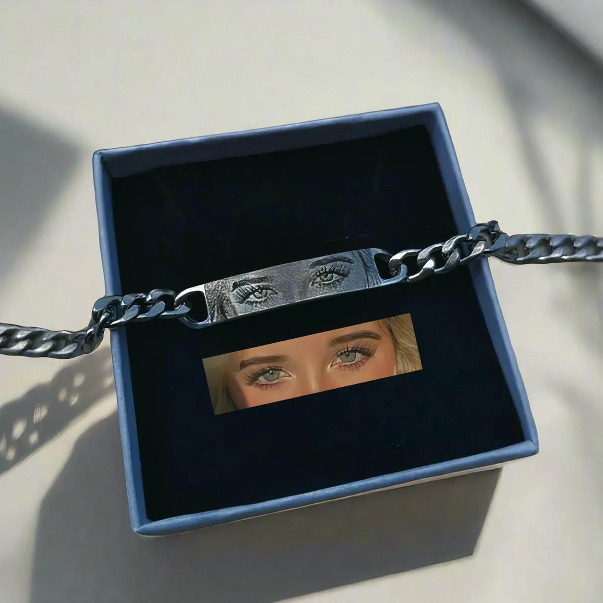Personalised laser engraved human eye portrait on a stainless steel bracelet in a gold finish, geometric design